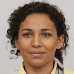 Joyful black adult female with short  brown hair and brown eyes