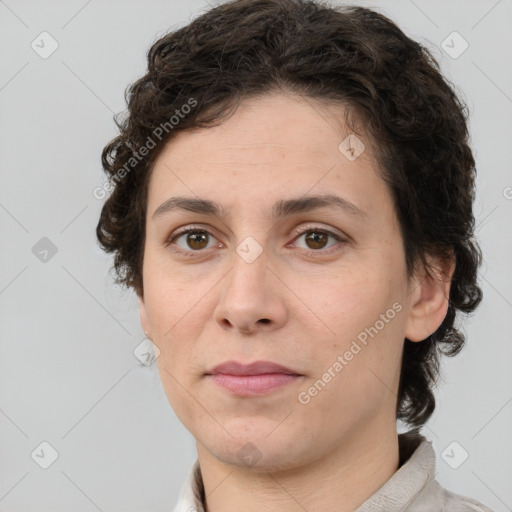 Joyful white adult female with short  brown hair and brown eyes