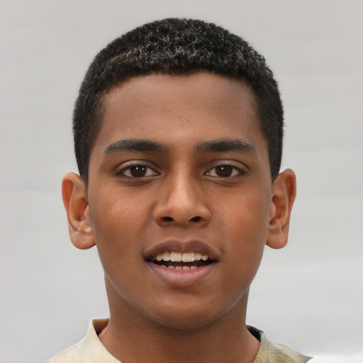 Joyful black young-adult male with short  brown hair and brown eyes