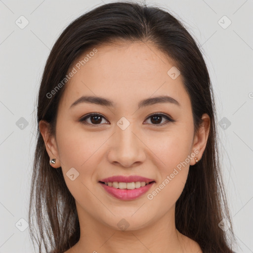 Joyful latino young-adult female with long  brown hair and brown eyes