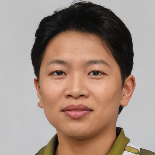 Joyful asian young-adult female with short  brown hair and brown eyes