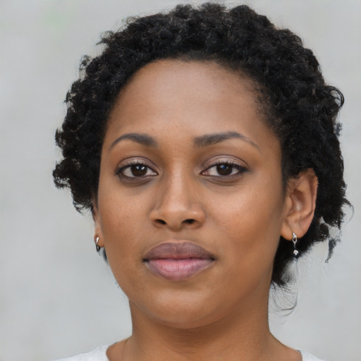 Neutral black young-adult female with short  brown hair and brown eyes