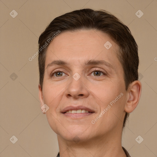 Joyful white adult female with short  brown hair and brown eyes