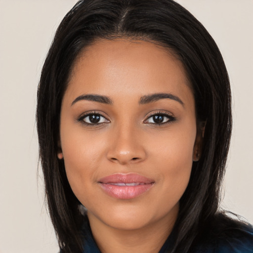 Joyful latino young-adult female with long  black hair and brown eyes