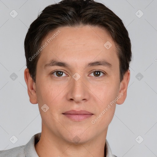 Joyful white adult male with short  brown hair and brown eyes