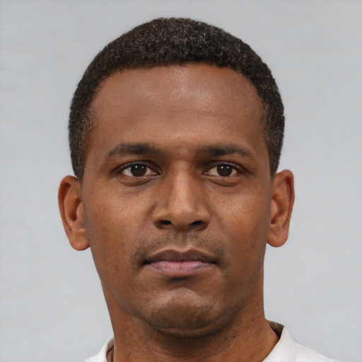 Neutral latino young-adult male with short  brown hair and brown eyes