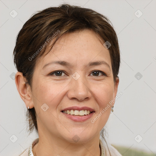 Joyful white adult female with short  brown hair and brown eyes