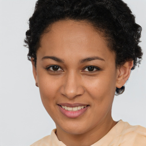 Joyful latino young-adult female with short  brown hair and brown eyes