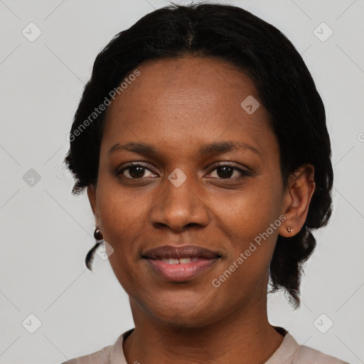 Joyful black adult female with short  black hair and brown eyes