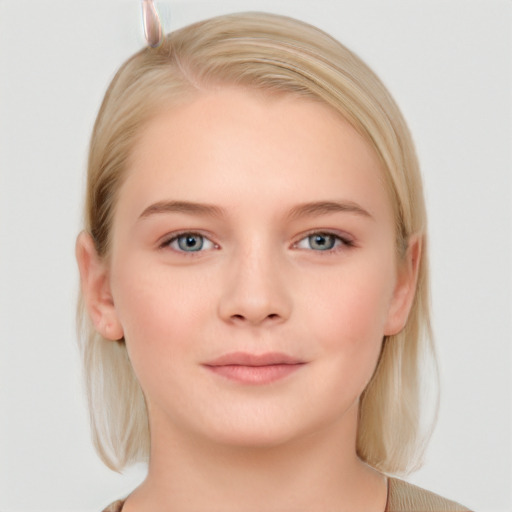 Joyful white young-adult female with medium  brown hair and blue eyes