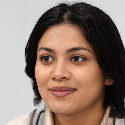 Joyful asian young-adult female with medium  black hair and brown eyes