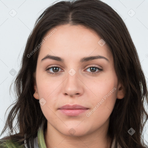 Neutral white young-adult female with long  brown hair and brown eyes