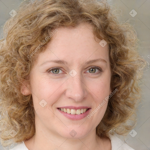 Joyful white young-adult female with medium  brown hair and green eyes