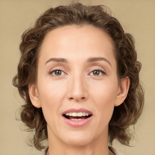 Joyful white young-adult female with medium  brown hair and green eyes