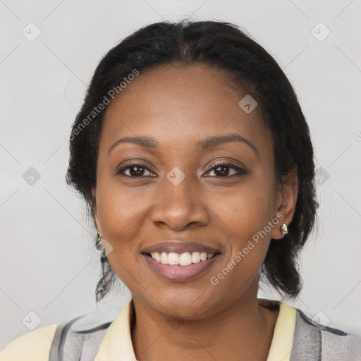 Joyful black young-adult female with medium  brown hair and brown eyes