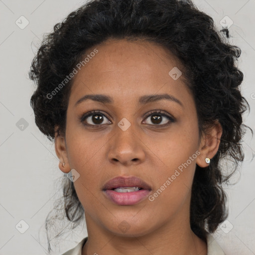 Joyful black young-adult female with medium  brown hair and brown eyes