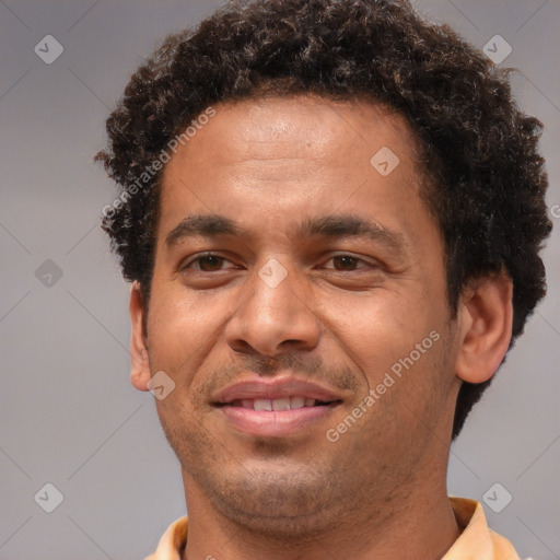 Joyful black young-adult male with short  brown hair and brown eyes