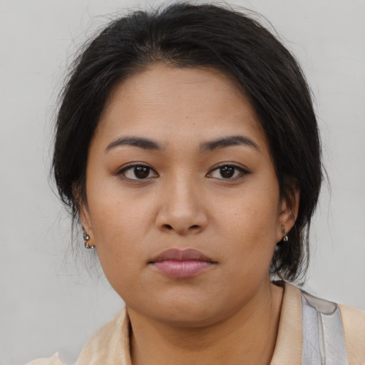 Neutral asian young-adult female with medium  brown hair and brown eyes