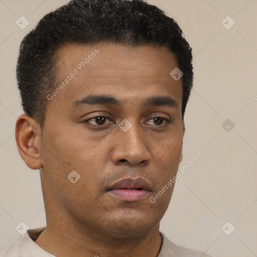 Neutral latino young-adult male with short  brown hair and brown eyes