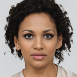 Neutral black young-adult female with medium  brown hair and brown eyes