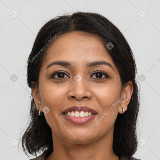 Joyful latino young-adult female with medium  black hair and brown eyes