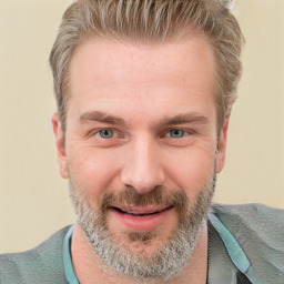 Joyful white adult male with short  brown hair and grey eyes