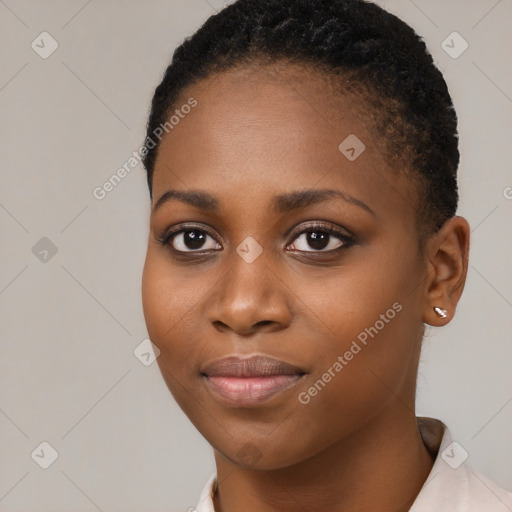 Joyful black young-adult female with short  brown hair and brown eyes