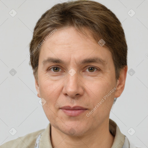 Joyful white adult male with short  brown hair and grey eyes