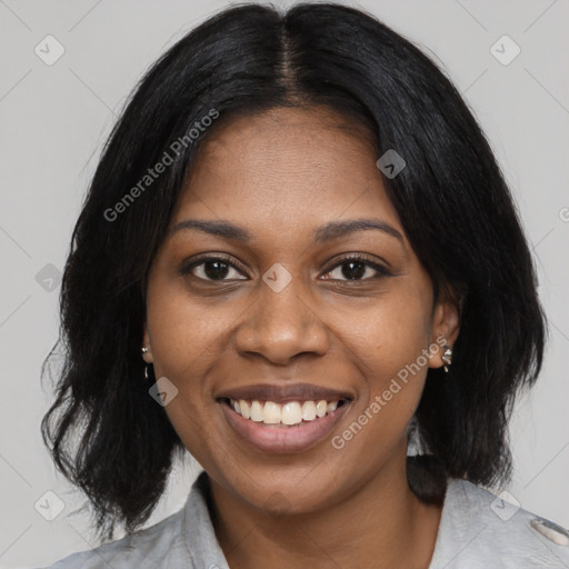 Joyful black young-adult female with medium  black hair and brown eyes