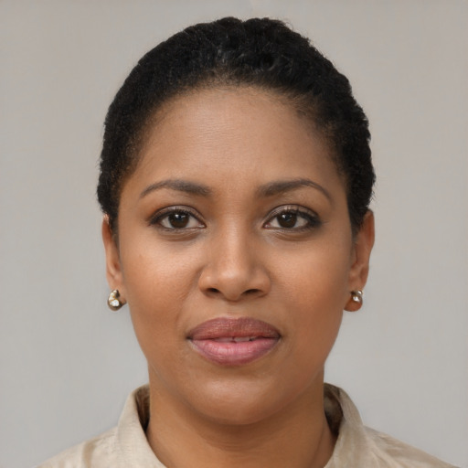 Joyful black young-adult female with short  brown hair and brown eyes