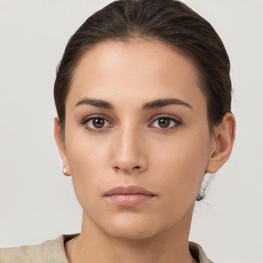 Neutral white young-adult female with short  brown hair and brown eyes