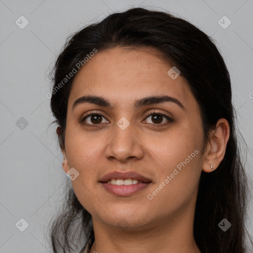 Joyful latino young-adult female with long  brown hair and brown eyes