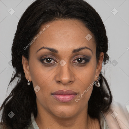 Joyful black young-adult female with long  brown hair and brown eyes