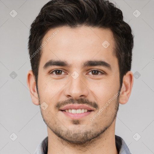 Joyful white young-adult male with short  black hair and brown eyes