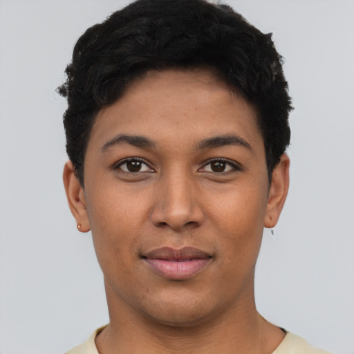 Joyful latino young-adult female with short  black hair and brown eyes