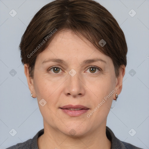 Joyful white adult female with short  brown hair and grey eyes