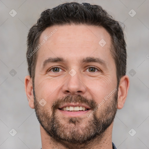 Joyful white adult male with short  brown hair and brown eyes