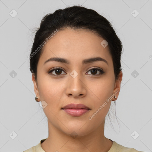 Joyful latino young-adult female with medium  brown hair and brown eyes