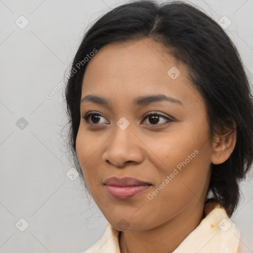 Joyful asian young-adult female with medium  brown hair and brown eyes