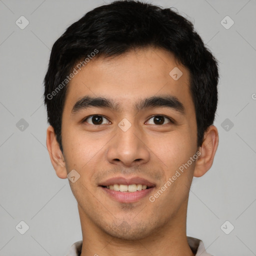 Joyful latino young-adult male with short  black hair and brown eyes