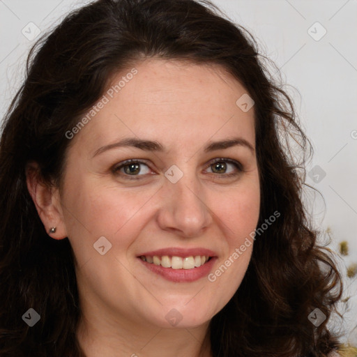 Joyful white adult female with long  brown hair and brown eyes