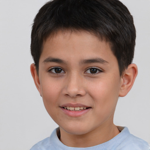 Joyful white child male with short  brown hair and brown eyes