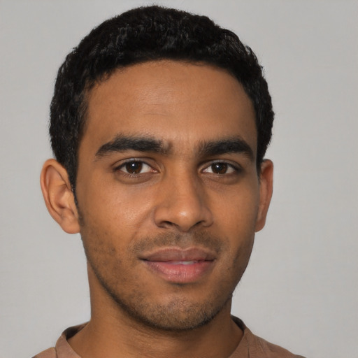 Neutral latino young-adult male with short  black hair and brown eyes