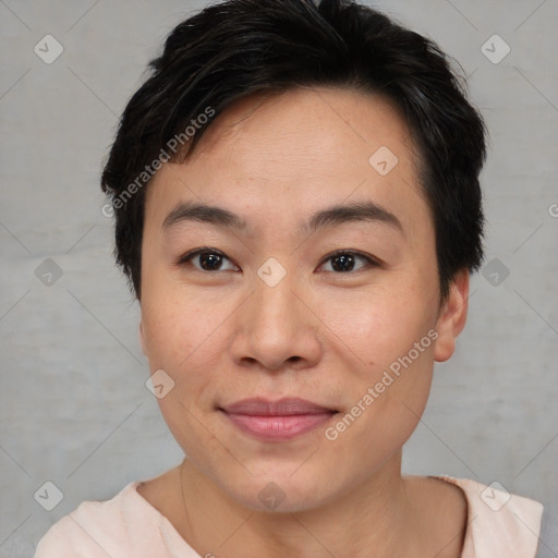 Joyful asian young-adult female with short  brown hair and brown eyes