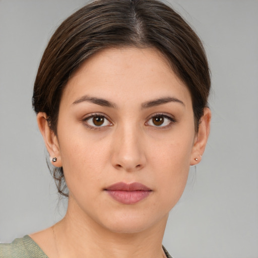 Neutral white young-adult female with short  brown hair and brown eyes