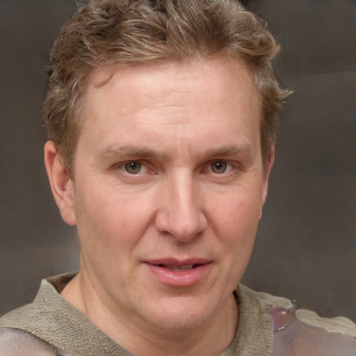 Joyful white adult male with short  brown hair and grey eyes