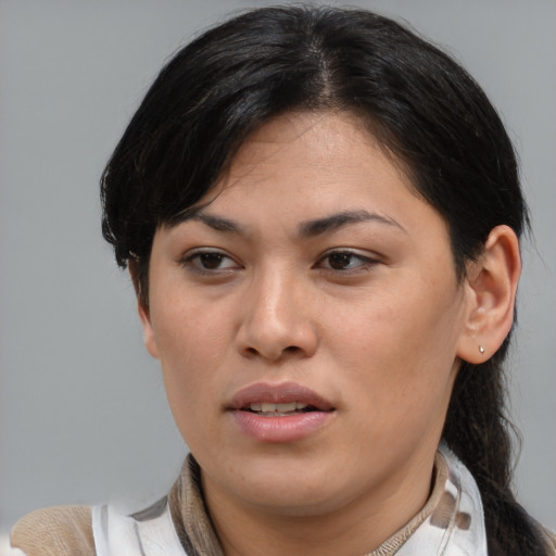 Joyful latino young-adult female with short  brown hair and brown eyes