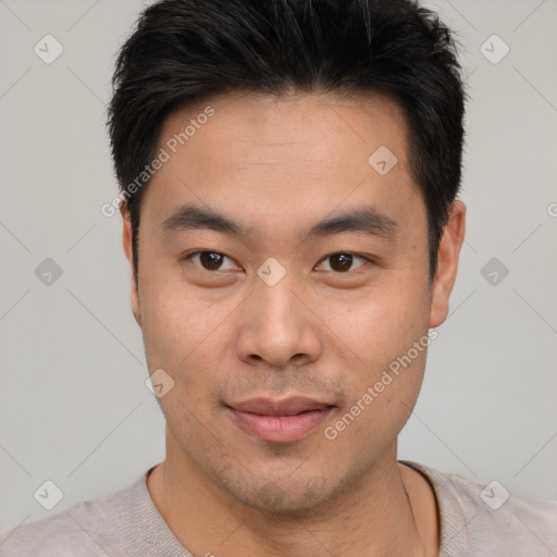 Joyful asian young-adult male with short  black hair and brown eyes