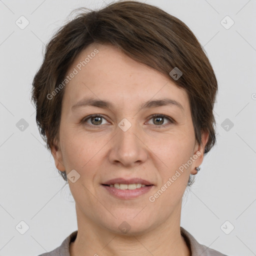 Joyful white adult female with short  brown hair and grey eyes