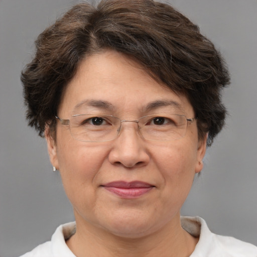 Joyful white middle-aged female with short  brown hair and brown eyes